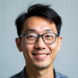 Professional headshot of Benny Tan